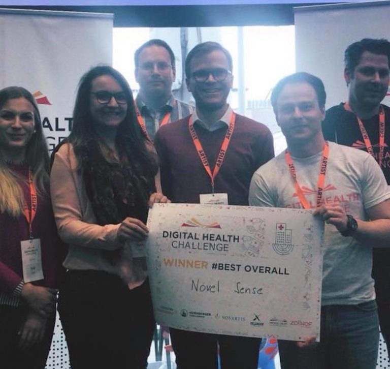Sascha Rudolph and NovelSense team accepting award for winning a hackathon in Nuremberg