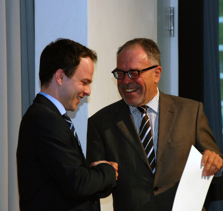 Sascha Rudolph receiving an award at the University of Pforzheim